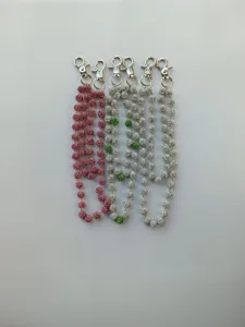 Detail shot of sparkling rhinestone ball pant chains with sturdy lobster clasps.