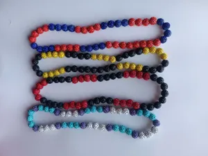 Detailed view of four colorful 12mm pave rhinestone clay bead Shamballa necklaces.