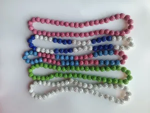 Variety of 12mm Shambhala rhinestone ball bead necklaces in pink, green and blue.