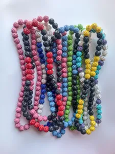 Close-up detail of 12mm multicolored rhinestone clay bead necklaces with elastic cord.