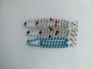Detailed view of 8mm rhinestone Shamballa bead pocket chains with shiny metal clasps.