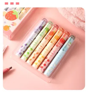 Close-up detail of colorful fruit and vegetable highlighter pen set in clear tray.