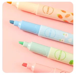 Cute fruit and vegetable highlighters detail close up, pastel aesthetic marker pens for students.