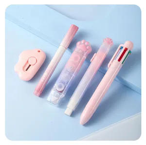 Cute pink gradient stationery set detail, includes multi-color pen and correction tape.