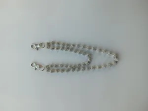 Close-up detail of silver rhinestone Shamballa bead chain pocket waist chain accessory.