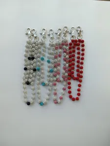 Detailed view of sparkly rhinestone paved ball pocket chains and pants chains for accessories.