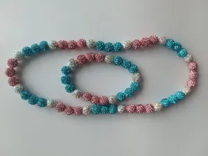 Close-up of pink and blue 10mm disco ball rhinestone necklace and bracelet set