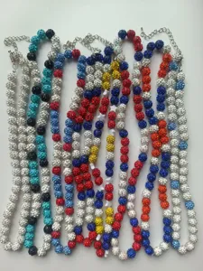 Detailed view of colorful clay rhinestone bead Shamballa necklaces in various vibrant patterns