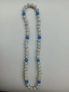 Detail view of Shamballa necklace featuring blue and white rhinestone clay beads.