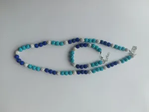 Detailed view of 10mm blue and silver pavé disco ball necklace and bracelet jewelry set