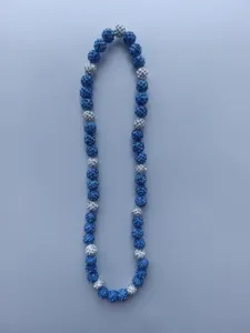 Detailed view of Shamballa necklace featuring sparkling blue and white rhinestone beads