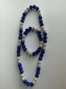 Close-up of sparkling blue and silver 10mm clay rhinestone ball necklace and bracelet set