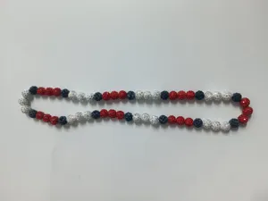 Detailed view of 12mm red white and blue rhinestone clay bead stretch necklace