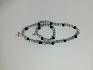 Close-up of Shamballa jewelry set featuring 10mm AB clay disco balls and crystal cross pendant