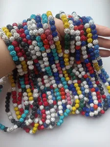 Detail of multi-color 10mm rhinestone clay bead Shamballa bracelets and necklaces.