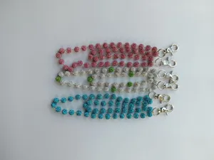 Sparkly rhinestone disco ball bead pocket chain strap detail, multi-color accessory charm.