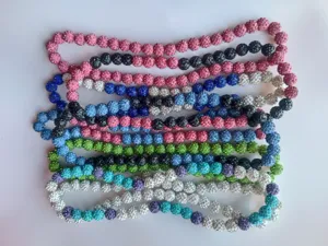 Close-up of 12mm Shamballa pavé rhinestone ball necklaces in multiple vibrant colors