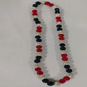 Detail view of the 12mm red white and blue clay pave disco ball beads elastic necklace