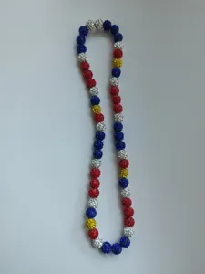 Close-up of a colorful Shamballa necklace with mixed rhinestone disco ball beads.