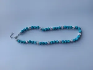 Blue and white rhinestone Shamballa bead necklace close-up view showing sparkling crystals.