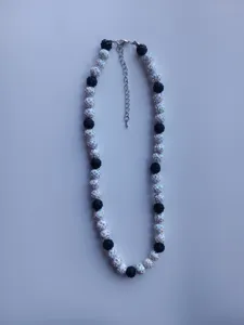 Detailed view of the black and white rhinestone Shamballa beaded necklace with clasp.