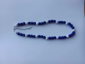 Blue and white rhinestone clay ball beaded necklace with lobster clasp and chain.