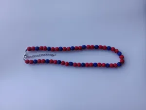 Detailed view of the 10mm red and blue rhinestone Shamballa bead necklace charm.