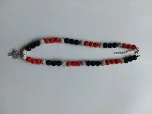 Detail view of Shamballa rhinestone bead necklace with cross pendant and lobster clasp.