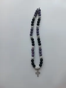 Detailed view of the sparkling Shamballa rhinestone bead necklace with a cross pendant.