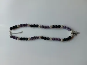 Detailed view of the 10mm rhinestone Shamballa bead necklace with a micro-paved cross pendant.