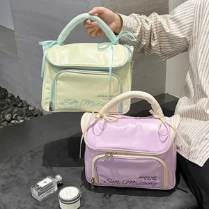 Grands sacs à cosmétiques portables et étanches en jaune et violet avec des nœuds mignons