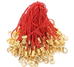 Detail view of red nylon mobile phone straps with golden metal lobster claw clasps for DIY crafts.