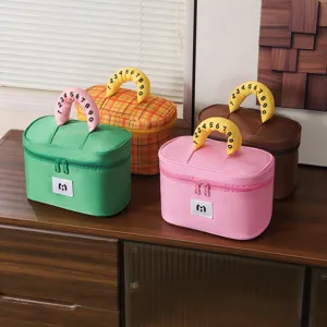 Four colorful large capacity cosmetic bags with numeric handles on a wooden cabinet