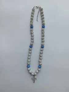 Detail view of sparkling Shamballa bead necklace featuring a micro paved iced out cross pendant