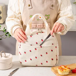 Insulated corduroy lunch bag with strawberry pattern and top handle