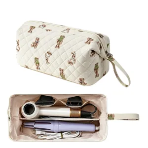 Bolsa acolchada con diseño de osos para guardar secador de pelo y rizador portátil.