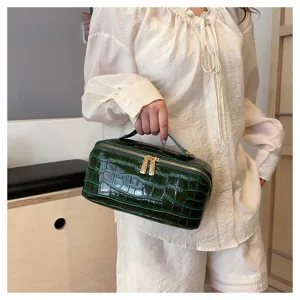 Premium dark green crocodile pattern travel cosmetic bag with gold hardware and top handle