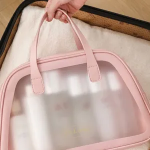 Large capacity pink handheld travel toiletry bag with semi-transparent frosted design