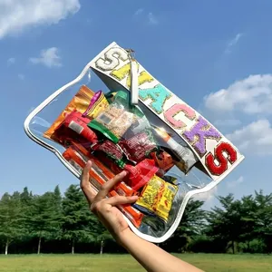 Clear PVC snack pouch with colorful embroidered SNACKS letters and white leather trim