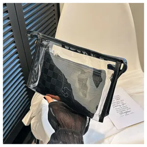 Detailed view of clear PVC travel makeup bag with a black checkerboard inner pouch