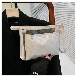 Detail view of the 2-piece PVC travel cosmetic bag set including a checkered inner pouch