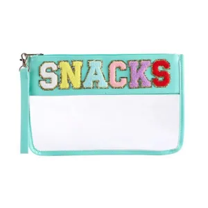 Detailed view of clear PVC makeup pouch with colorful snacks chenille letter patches.