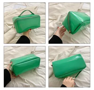 Multiple views of a green glossy handheld makeup bag with gold zipper detail