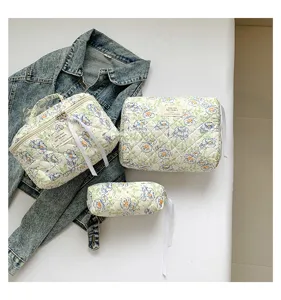 Three-piece set of stylish floral quilted cotton cosmetic bags for travel and storage