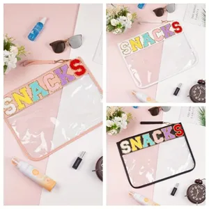 Transparent PVC pouch set with colorful 'SNACKS' chenille letters and wrist strap.