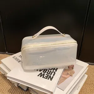 Minimalist large capacity transparent travel cosmetic bag with handle and gold studs