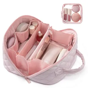 Detailed interior view of a large pink quilted makeup bag for travel storage