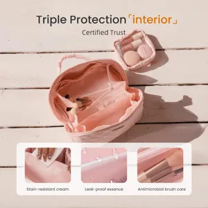 Detailed view of pink quilted makeup bag interior with stain-resistant and leak-proof lining