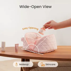 Detail of pink quilted makeup bag with 180-degree wide-open view for skincare storage