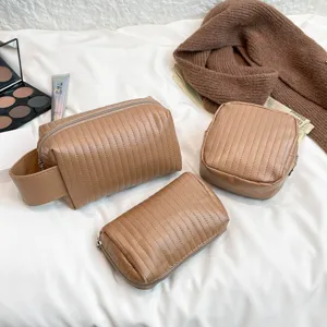 Detailed view of the three-piece brown quilted waterproof PU leather makeup bag set